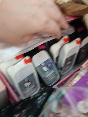 Assorted Black and White Bottles with Orange Caps